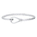 Silver bracelet with a heart-shaped clasp on a white background