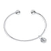 Silver bracelet with a round clasp and a tag on a white background