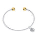Silver bracelet with gold beads and a tag on a white background