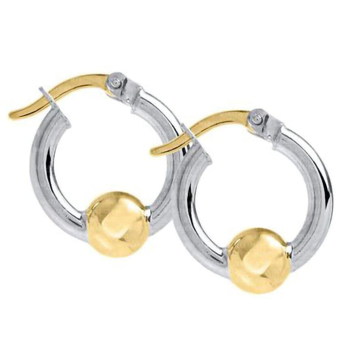 Silver hoop earrings with gold ball accents on a white background