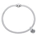 Silver bracelet with a small round charm on a white background