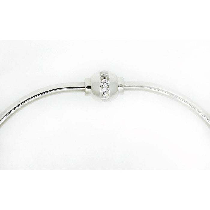 Silver bracelet with a clear gemstone bead on a white background