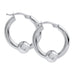 Pair of silver hoop earrings on a white background