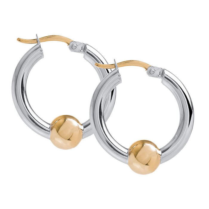 Pair of hoop earrings with gold and silver finish on a white background