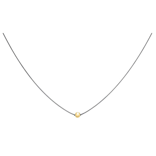 Necklace with a small gold bead on a white background