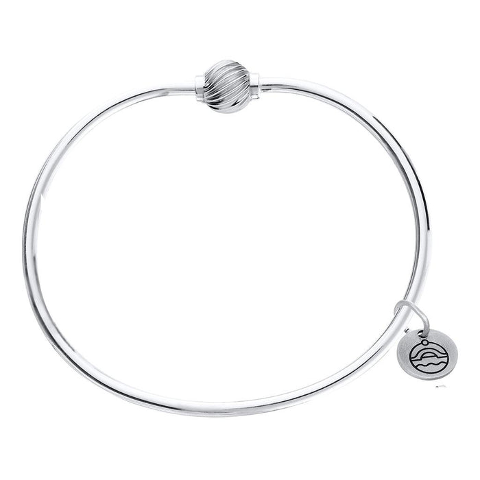 Silver bracelet with a heart-shaped tag on a white background