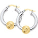 Pair of hoop earrings with gold and silver finish on a white background