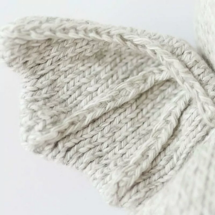 Close-up detail of the knitted wing on the Cuddle + Kind Baby Bat in Grey stuffed toy.