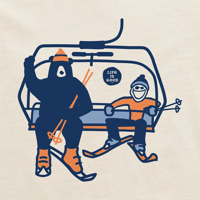 Close-up of Life Is Good Ski Lift graphic featuring Jake and a bear on a chairlift wearing winter gear.