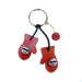 Red mitten-shaped keychain with a black cord on a white background