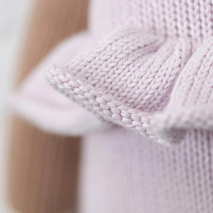Close-up of the lavender knitted ruffle detail on the deer doll’s romper.