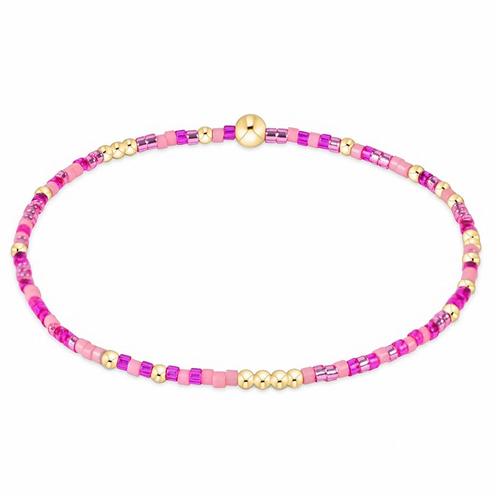 enewton design Hope Unwritten Bracelet featuring fuchsia seed beads with 14k gold-filled accents displayed in a circular layout on a white background.