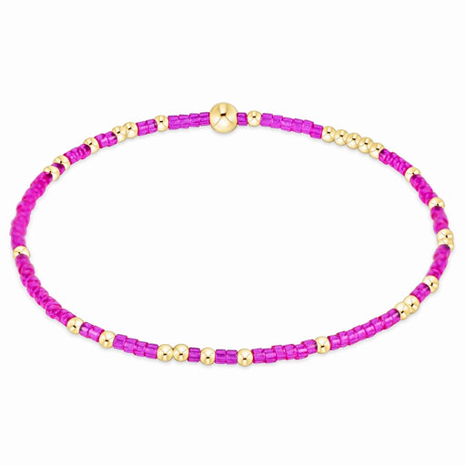 enewton design Hope Unwritten Bracelet featuring fuchsia seed beads with 14k gold-filled accents displayed in a circular layout on a white background.