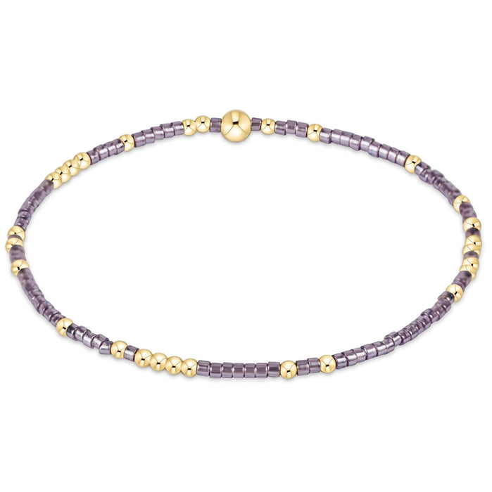 enewton design Hope Unwritten Bracelet in taupe with a twist featuring taupe glass beads and 14k gold-filled accents in a stretch beaded design.