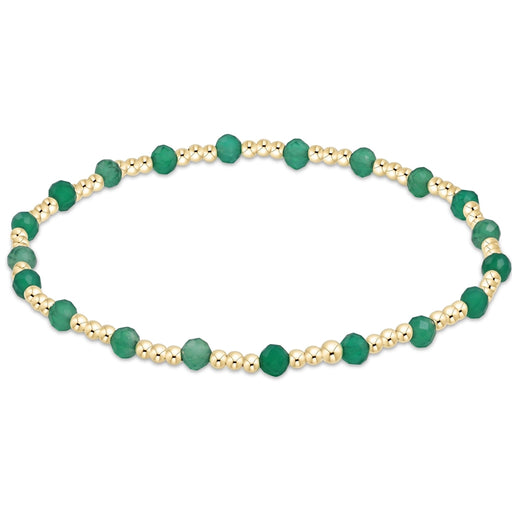 enewton Sincerity Pattern Bead Bracelet with faceted green onyx beads and 14k gold-filled beads arranged in a repeating pattern on a stretch band.