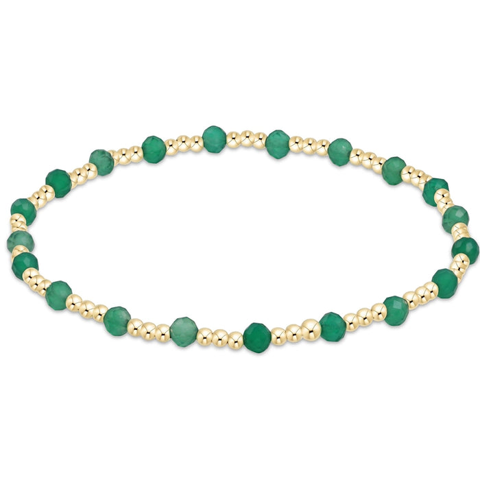 enewton Sincerity Pattern Bead Bracelet with faceted green onyx beads and 14k gold-filled beads arranged in a repeating pattern on a stretch band.
