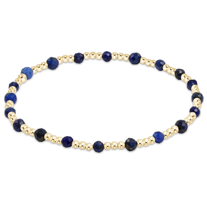 enewton Sincerity Pattern Bead Bracelet with lapis gemstone beads and 14k gold-filled beads arranged in a repeating pattern on a stretch band.