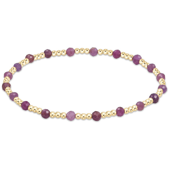 enewton Sincerity Pattern Bead Bracelet with Ruby beads and 14k gold-filled beads arranged in a repeating pattern on a stretch band.