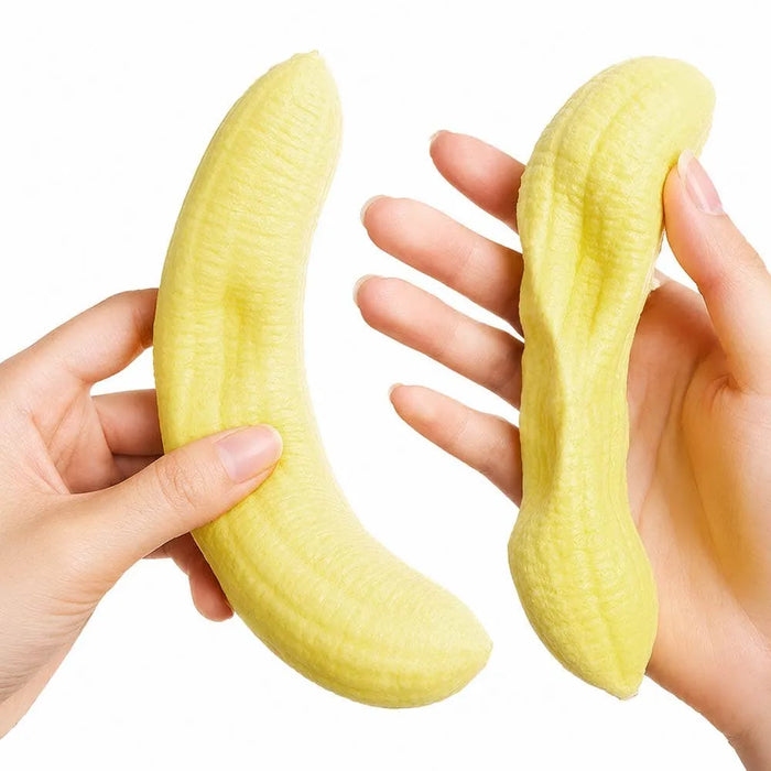 Two hands holding yellow silicone banana-shaped molds against a white background