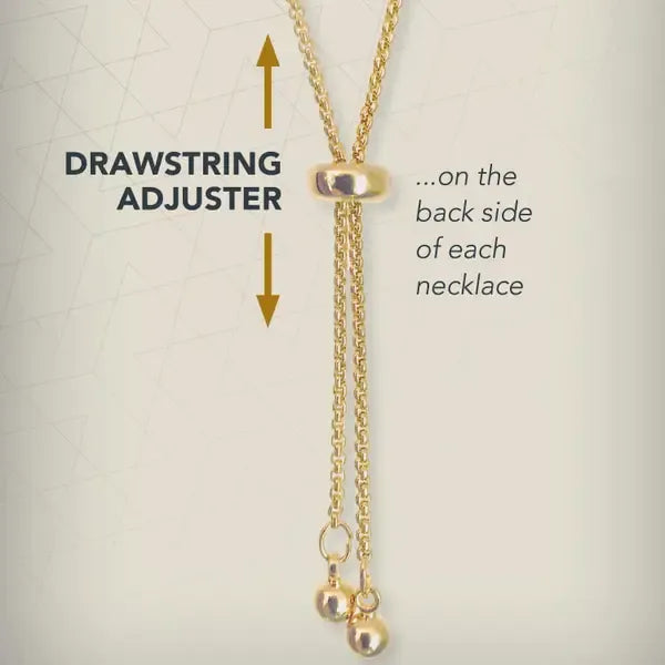 Gold necklace with drawstring adjuster on a light gray background