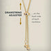 Gold necklace with drawstring adjuster on a light gray background