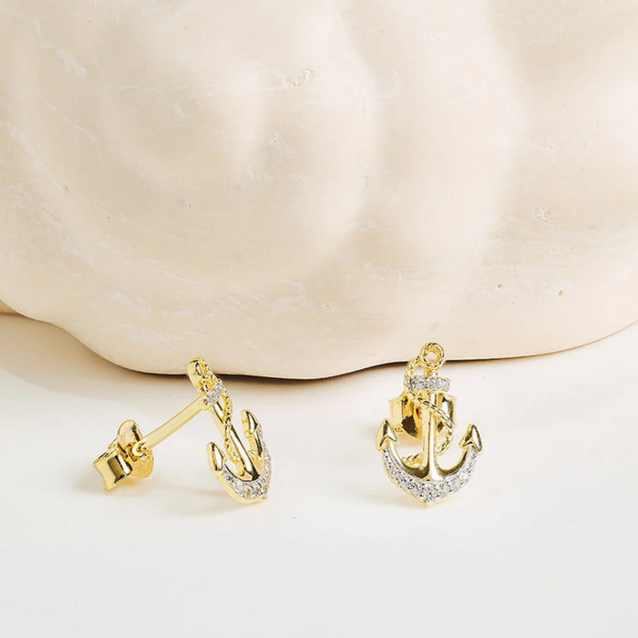 Ship anchor Gold with crystal accents  Shanore earring on a clean background 