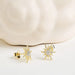 white Sapphire Sun Earrings on a light background