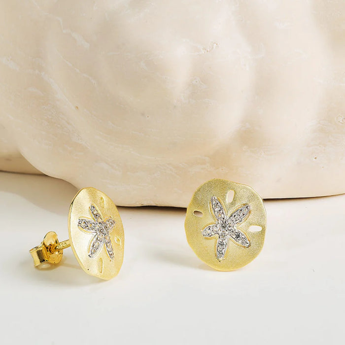 Shanore : 14kt Gold Vermeil White Sapphire Sand Dollar Earrings displayed near shell