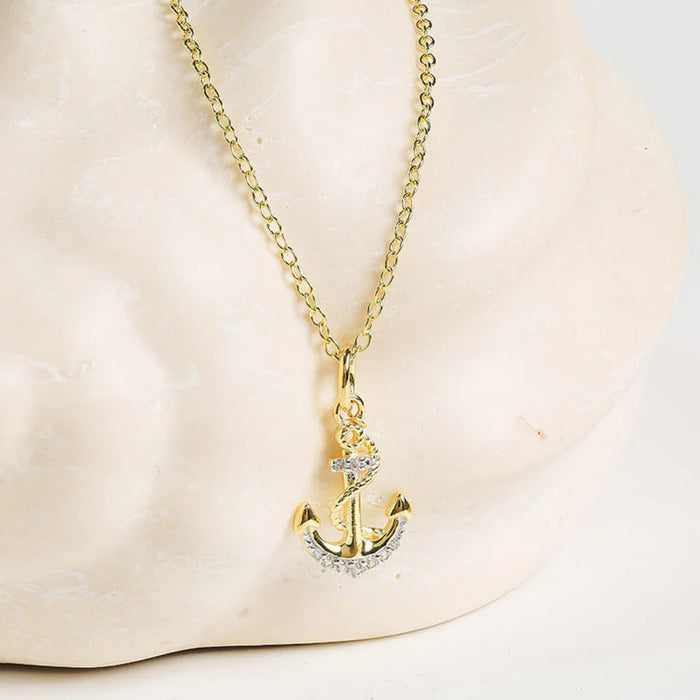 Ship anchor Gold with crystal accents  Shanore necklace on a clean background  
