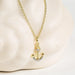 Ship anchor Gold with crystal accents  Shanore necklace on a clean background  