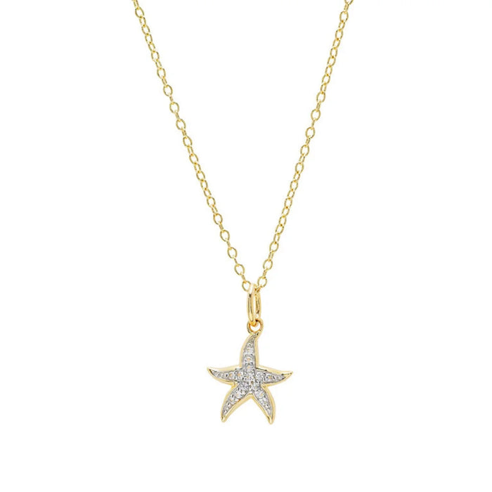 Starfish shaped necklace with diamond accents on a white background