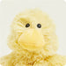 Close-up of a yellow plush duck toy on a white background