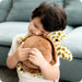 Young Boy holding Warmies Turtle