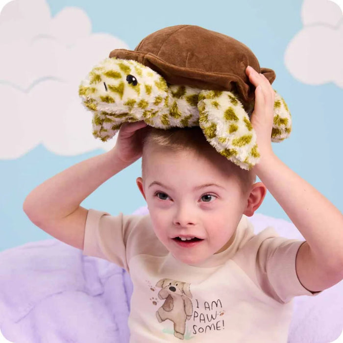 Young boy with Warmies : Turtle  on his head