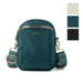 Teal crossbody bag with gold zippers and accents on a white background, featuring the brand 'KEDZIE'.