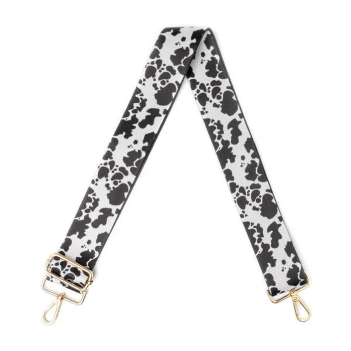 Bag strap with black floral pattern on a white background
