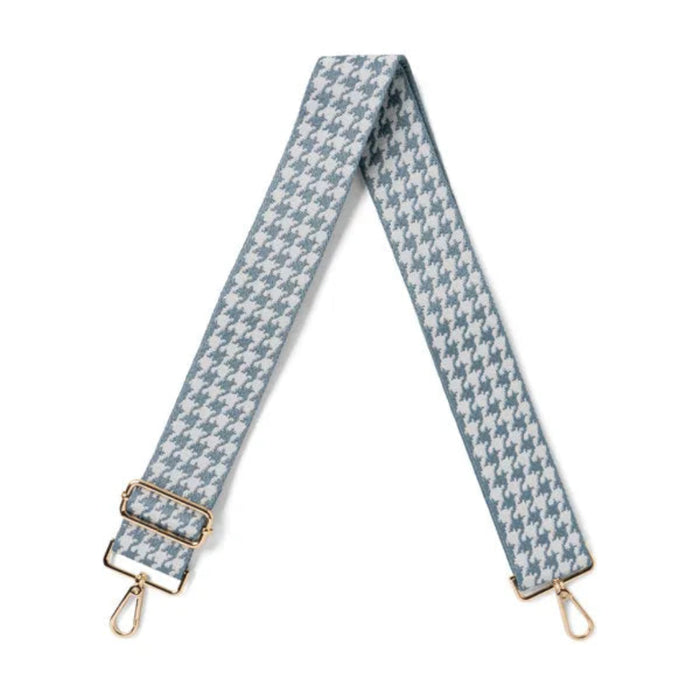 Blue and white houndstooth patterned strap with gold hardware on a white background