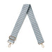 Blue and white houndstooth patterned strap with gold hardware on a white background