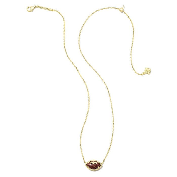 Kendra Scott football short pendant necklace in gold with orange goldstone football charm on delicate chain