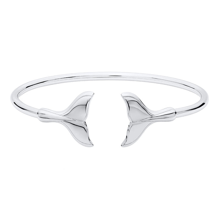 Silver bangle with whale tail design on a white background