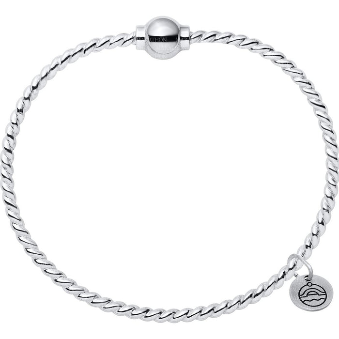Silver bracelet with a heart charm on a white background
