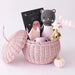 Little Nova the Kitten doll in a pink wicker gift basket with children’s book and plush accessories, perfect baby shower gift set.