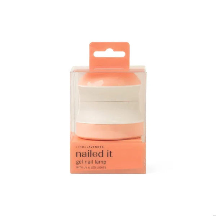 Coral gel nail lamp in packaging with 'nailed it' text on a white background