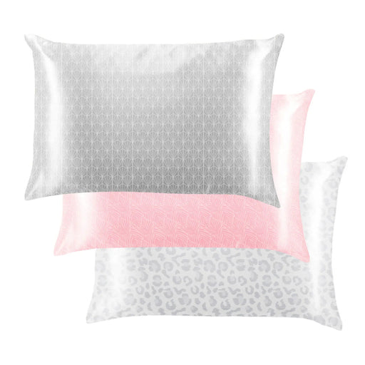 Three satin pillowcases with different patterns on a white background