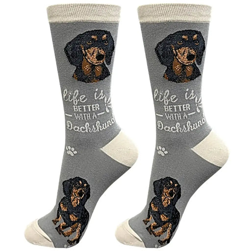 A pair of gray crew socks featuring a dachshund graphic and the text 'life is BETTER WITH A Dachshund' on a white background.