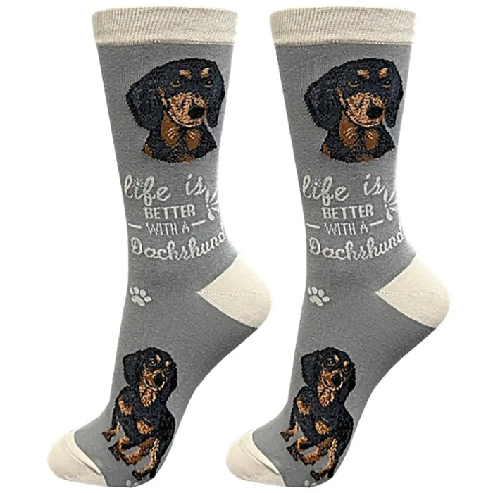 A pair of gray crew socks featuring a dachshund graphic and the text 'life is BETTER WITH A Dachshund' on a white background.