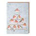 Christmas card/advent calendar with robins on a branch against a snowy background