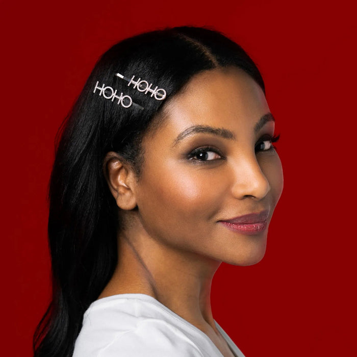 Woman wearing a headband with 'HOHO HOHO' text against a red background