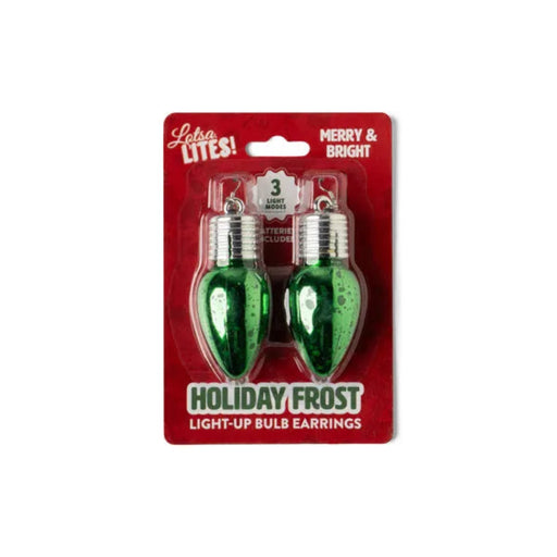 Packaged holiday light-up bulb earrings with green bulbs on a red background