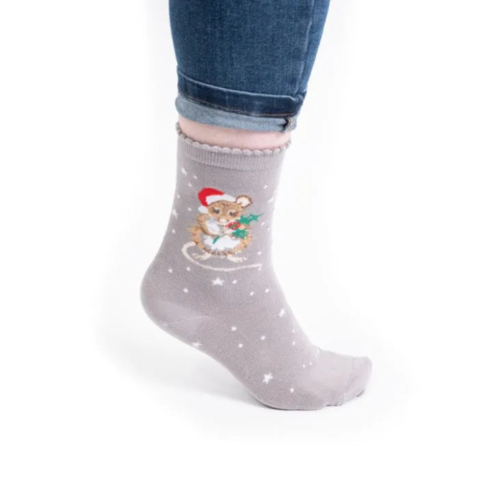 Gray sock with mouse design worn by a person on a white background
